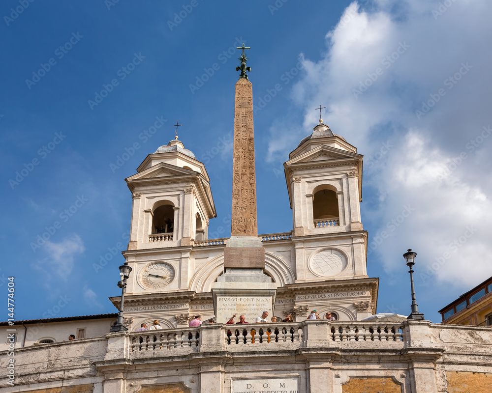 Egyption Obelisk and Trinita dei Monti Church on top of Spanish Steps in Rome, Italy