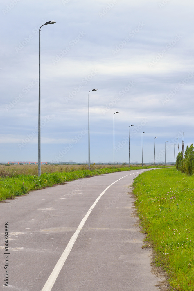 Bike path at summer cloud day.