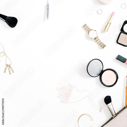 Beauty blog concept. Professional female make up accessories: watches, necklace, lipstick, brush, powder on white background. Flat lay, top view trendy fashion feminine background.