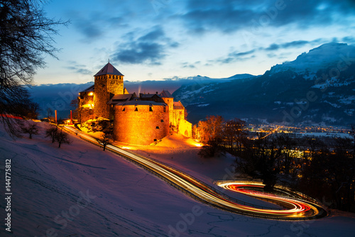 Vaduz, Liechtenstein. Illuminated castle of Vaduz at sunset photo