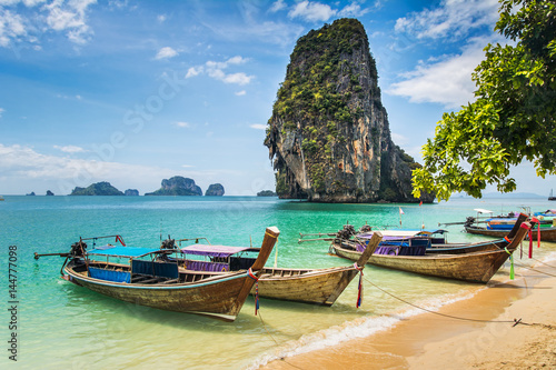 Amazing view of beautiful beach with longtale boats. Location: Railay beach, Krabi, Thailand, Andaman Sea. Artistic picture. Beauty world. © olenatur