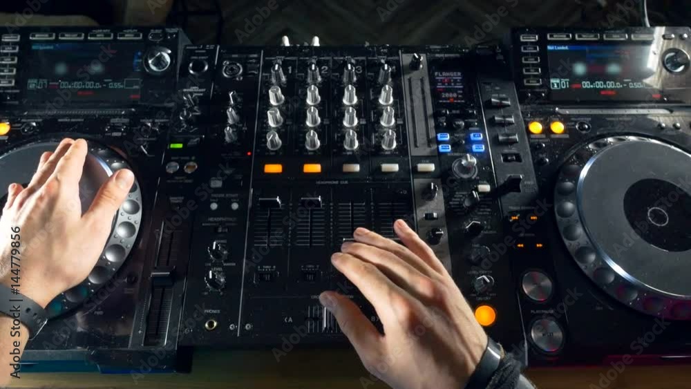 Disco and Club DJ hands mixing at night club party. 4 Disco and Club DJ hands mixing at night club party. 4