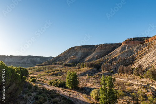 sunset over a canyon in the mountains