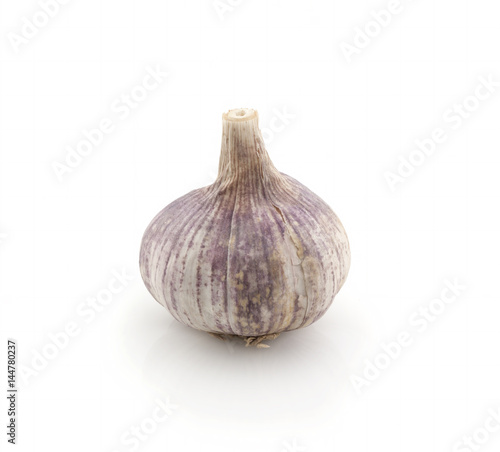 Old garlic whole on a white background. Isolated