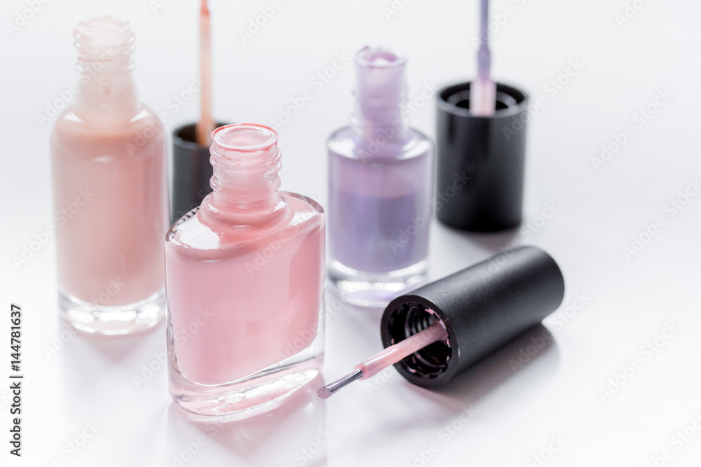Bottles with nail polish over white background Bottles with nail polish over white background