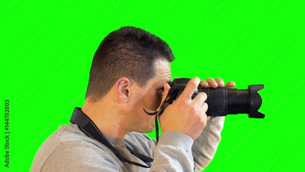 Greenscreen Photographer Close Up Side View Zooming and Focusing to Snap Photo Greenscreen Photographer Close Up Side View Zooming and Focusing to Snap Photo