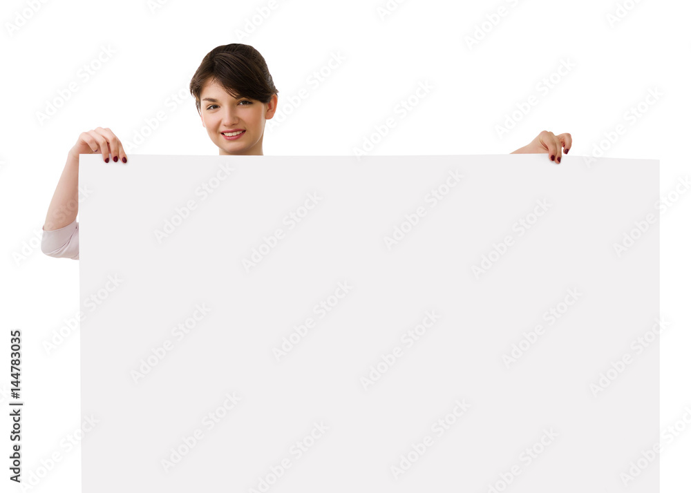Young pretty business woman in white and blue suit holds large sheet of paper with place under the inscription. Young pretty business woman in white and blue suit holds large sheet of paper with place under the inscription.