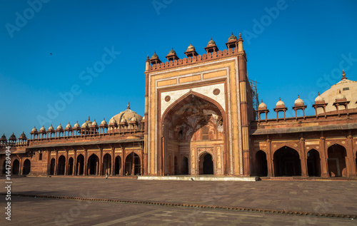 Jama Masjid at Fatehpur Sikri Agra - a historic Mughal India architecture mosque built with red sandstone and intricate wall carvings.