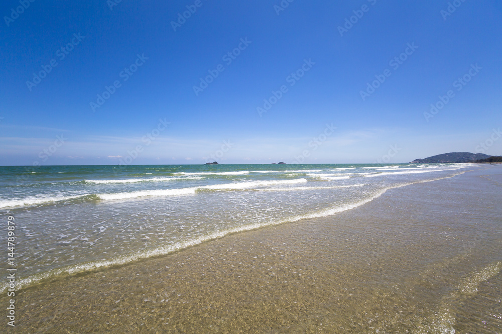 view of tropical beach with wave on the sunny sky. Summer paradise beach.