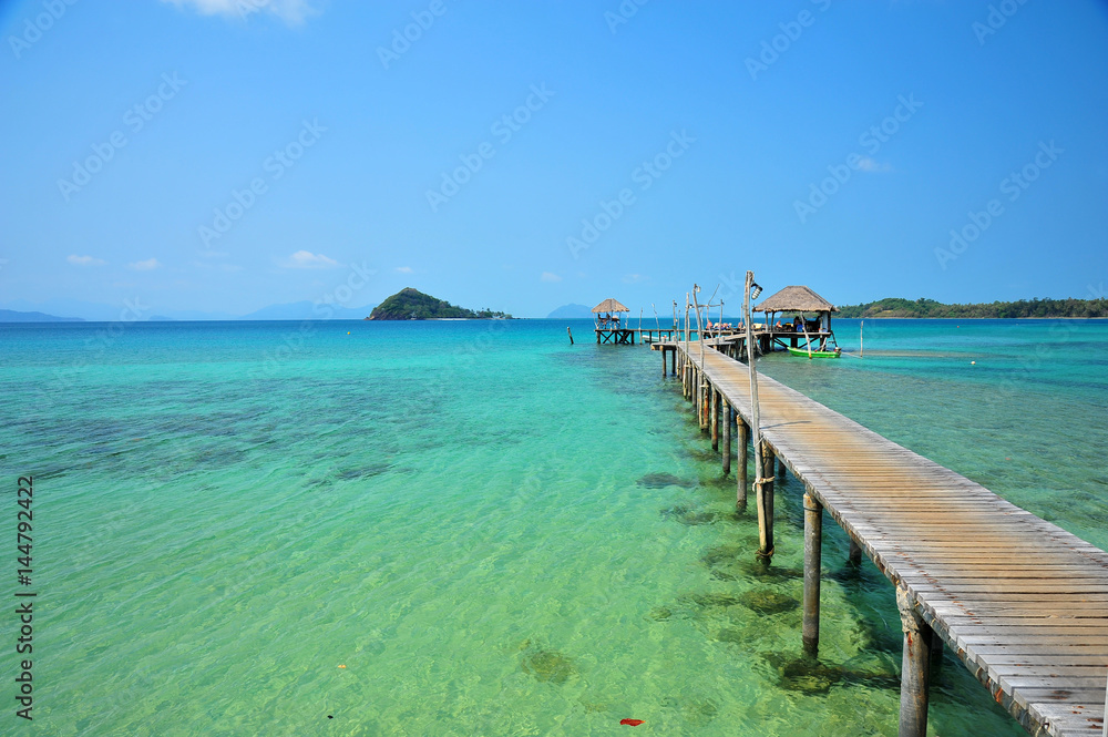 Beach on Tropical Islands with Wooden Piers
