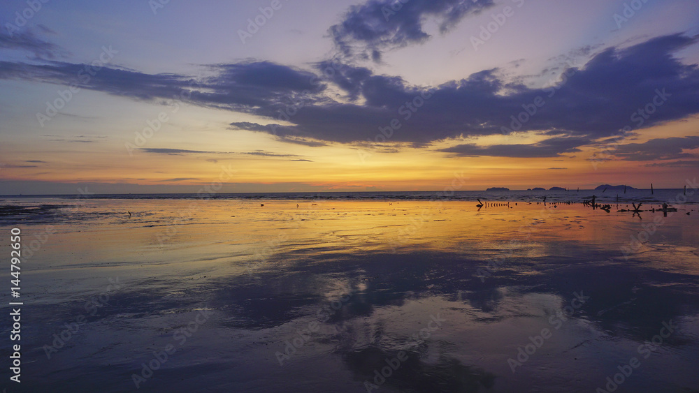 Beautiful twilight view at seascape with reflections of sky.