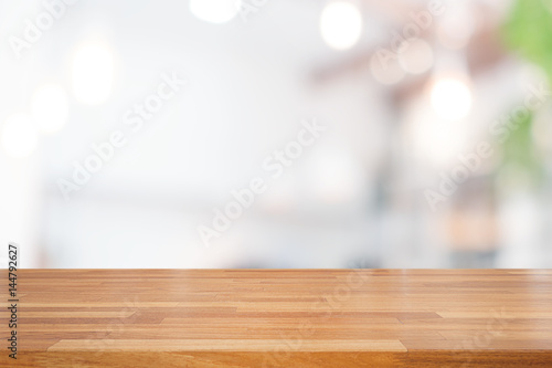 Empty wooden table and blurred white nature background
