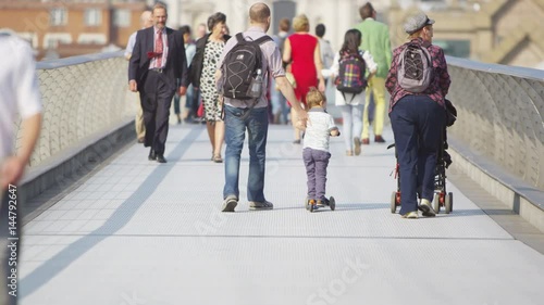 LONDON SEPTEMBER 2014 - Diverse crowd of people crossing Millennium footbridge