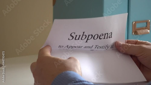 Man receiving subpoena letter photo