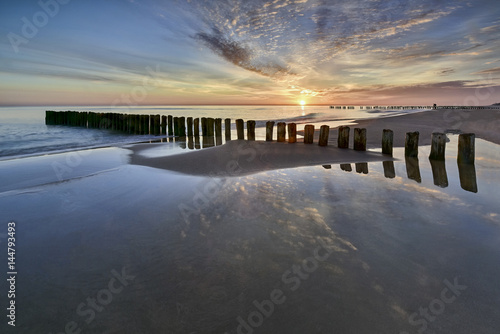 Fototapeta Naklejka Na Ścianę i Meble -  Beautiful sandy beach with a wooden breakwater, Poland , Chalupy
