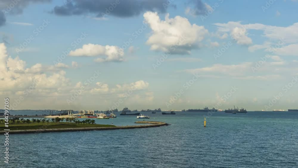 Time lapse Singapore Seascape From Marina Barrage with Cargo ship at port and nice sky with cloud moving Time lapse Singapore Seascape From Marina Barrage with Cargo ship at port and nice sky with cloud moving