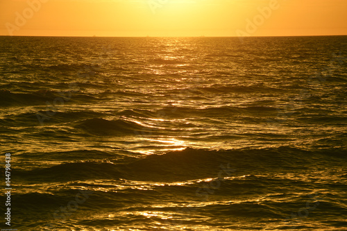 Beautiful sunset view at seascape with ripple wave. Composition of nature.