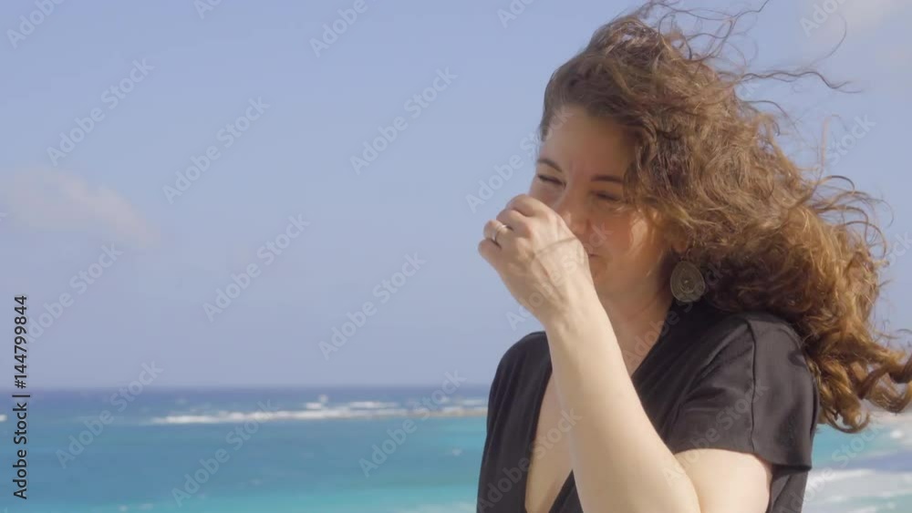 Beautiful womans hair is blown by the wind Beautiful womans hair is blown by the wind
