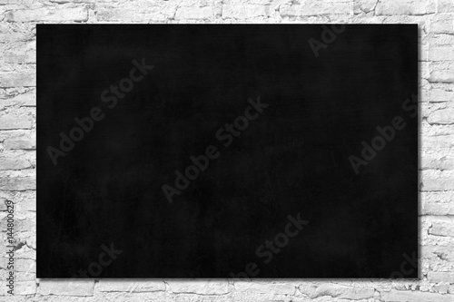 Black Board on White Brick Wall Texture Background.