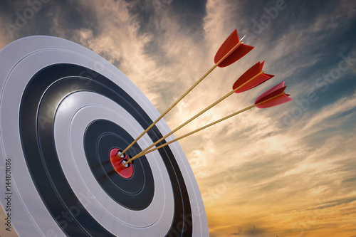 3D rendered illustration of target with arrows at sunset. photo