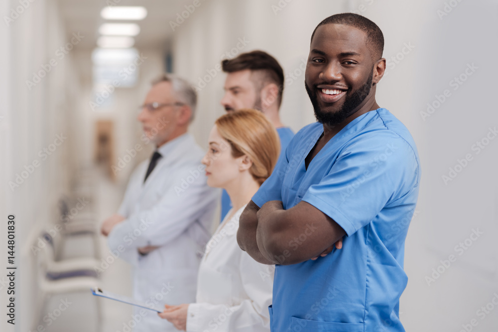 Nice African American intern enjoying working in the clinic Nice African American intern enjoying working in the clinic