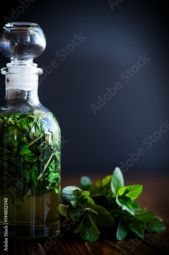 Mint syrup in a glass bottle