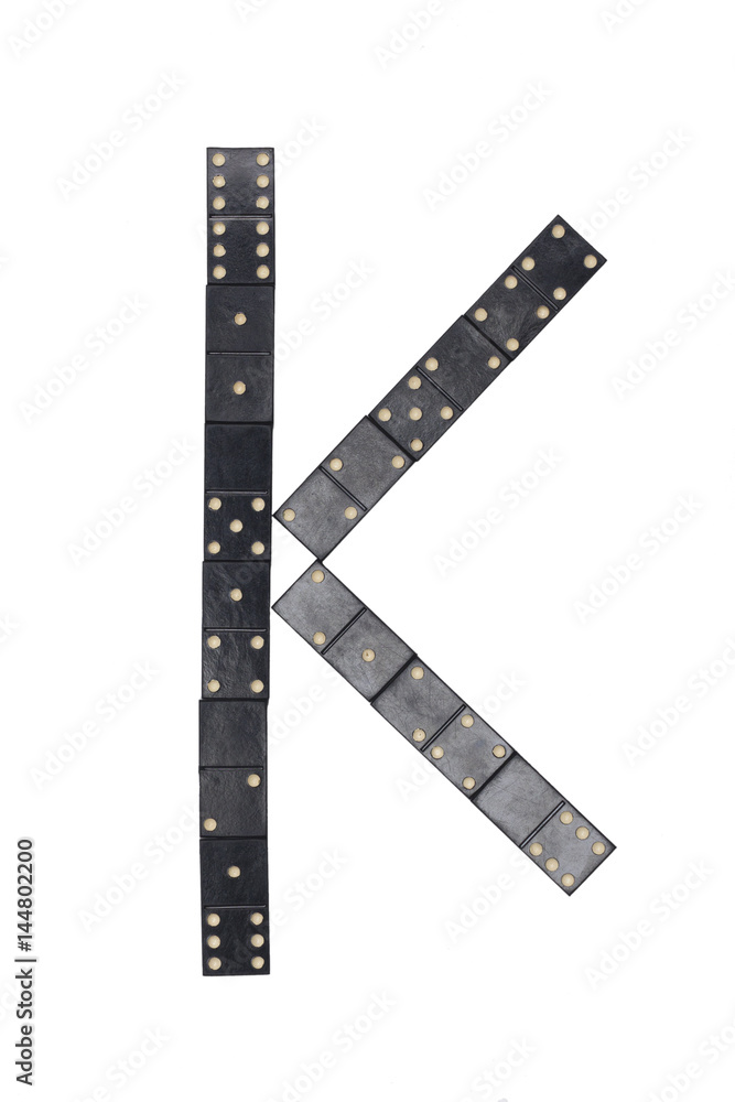 letter K made of black dominoes tiles letter K made of black dominoes tiles