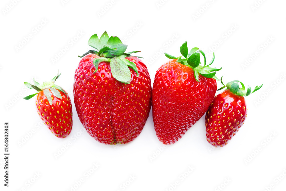Four ripe red strawberry on a white background. Isolated Four ripe red strawberry on a white background. Isolated