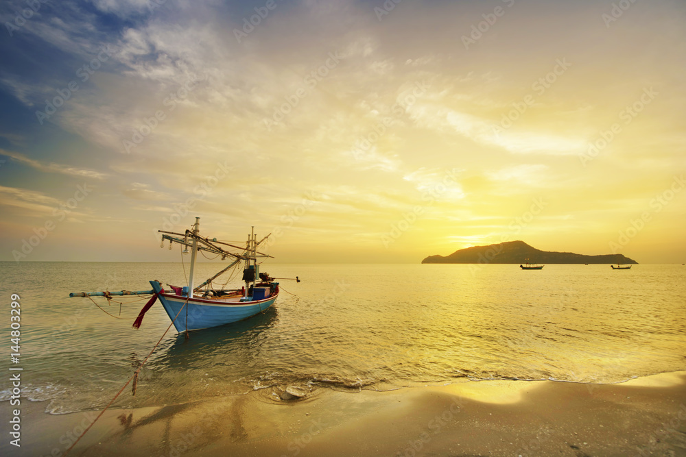 Fisherman boat at sunrise
