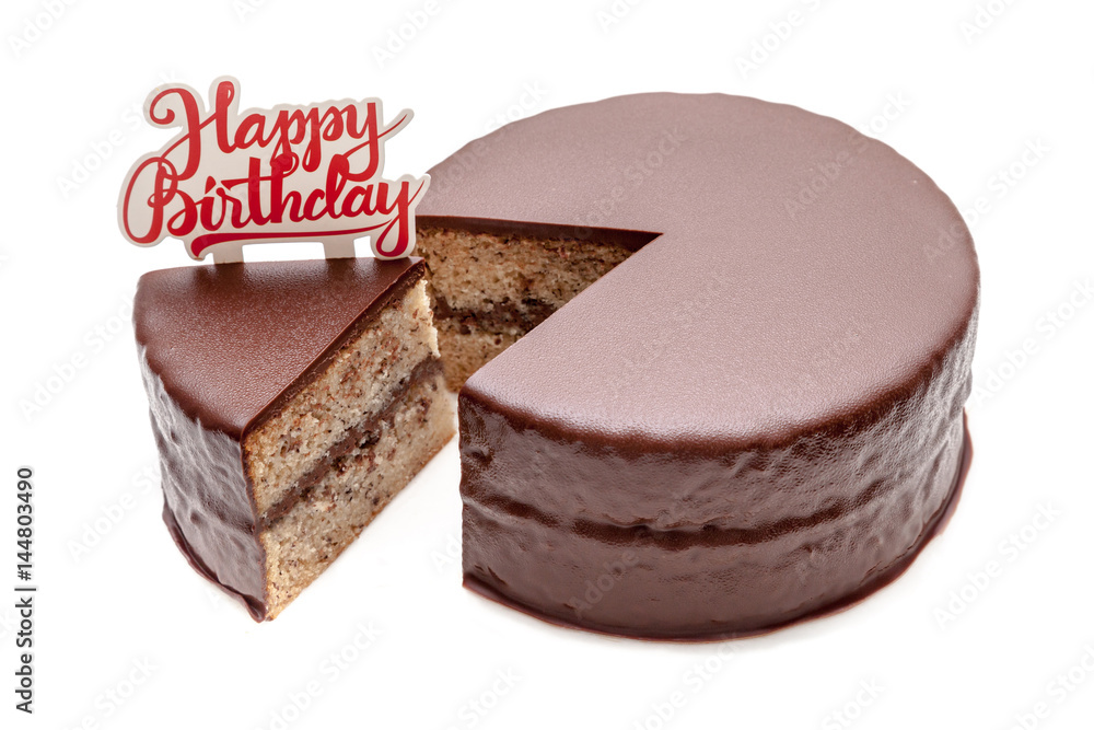 Sliced chocolate ganache cake pound with happy birthday sign on white background isolated