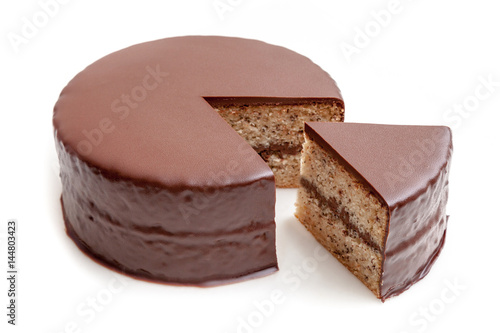 Fotografia, Obraz Sliced chocolate ganache cake pound on white background isolated