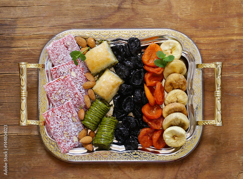 Oriental sweets  (baklava, rahat loachum) and dried fruits  photo