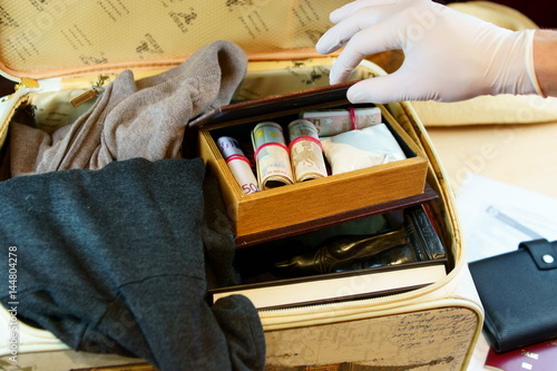 Suitcase with money and drugs on custom inspection