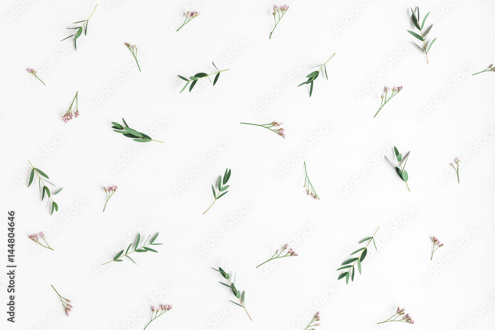 Flowers composition. Pattern made of pink flowers and eucalyptus branches on white background. Flat lay, top view Flowers composition. Pattern made of pink flowers and eucalyptus branches on white background. Flat lay, top view
