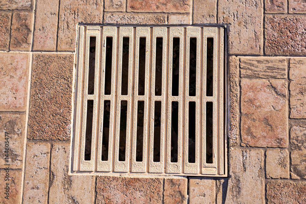 metal storm drain with water running into it metal storm drain with water running into it