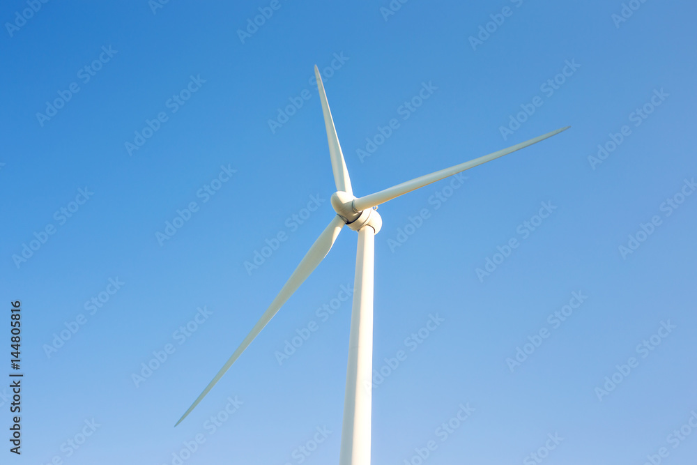Wind turbines generating electricity with blue sky - energy conservation concept Wind turbines generating electricity with blue sky - energy conservation concept
