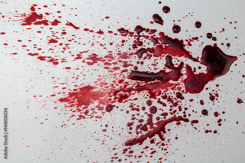 Splattered blood stain isolated on white background - photo photo
