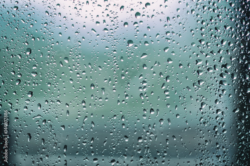 Rain drops, water drops of rain on a window glass.