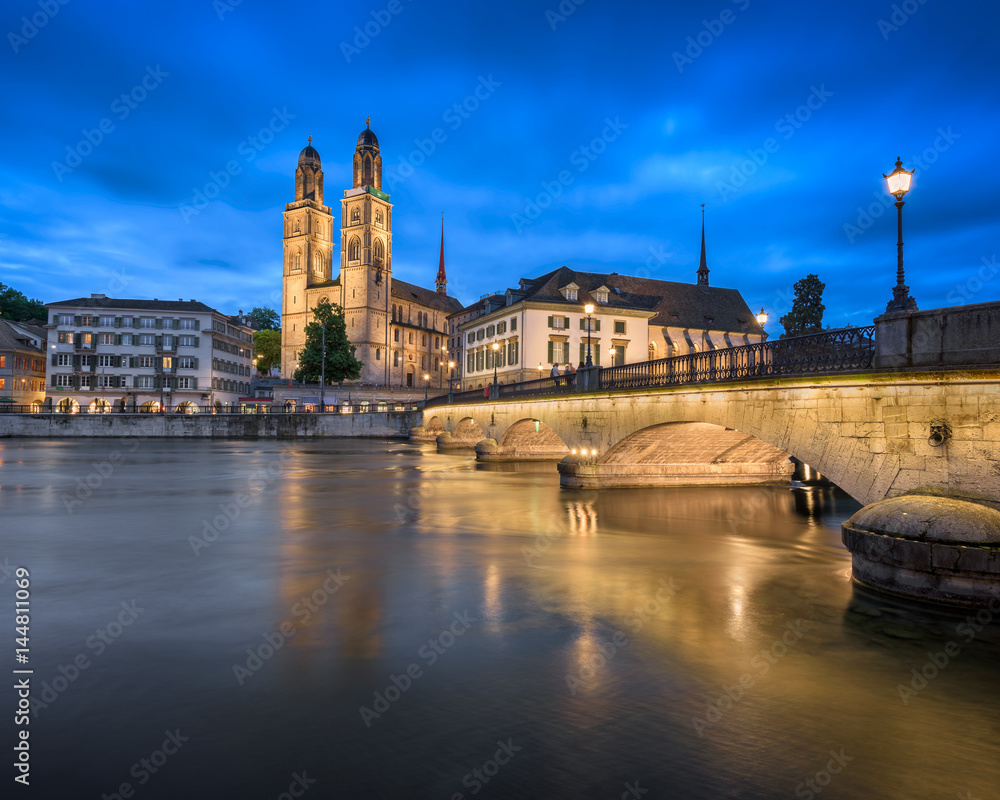 Fototapeta premium Grossmunster Church and Limmat River in the Evening, Zurich, Switzerland