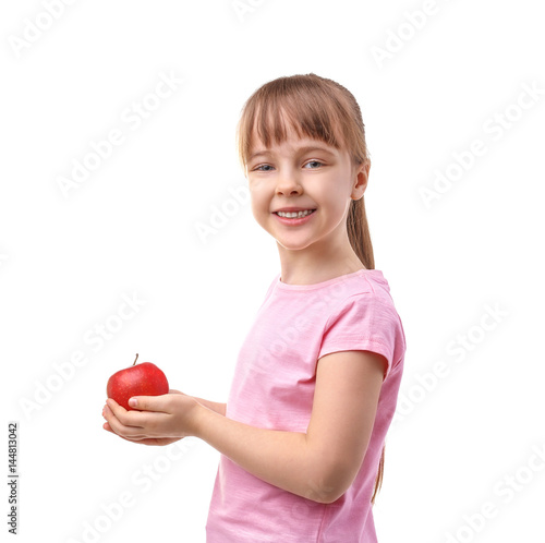 Happy schoolgirl with apple...
