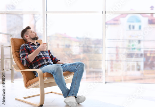 Happy young man resting in ...