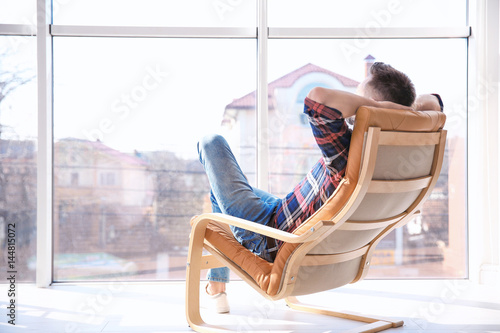 Happy young man resting in ...