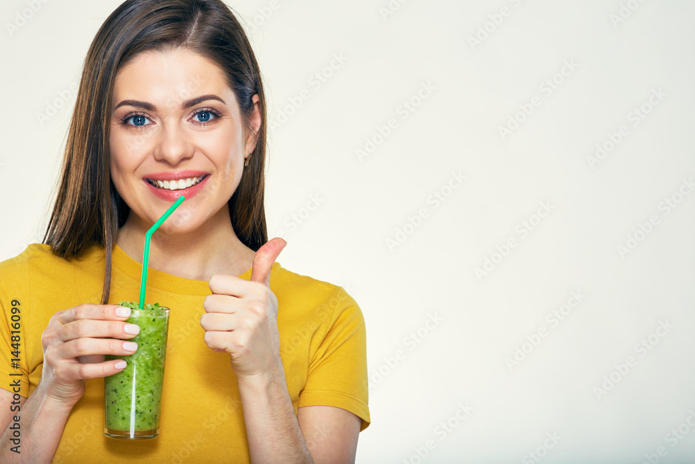 Smiling woman holding detox green vegetabless drink glass. Smiling woman holding detox green vegetabless drink glass.