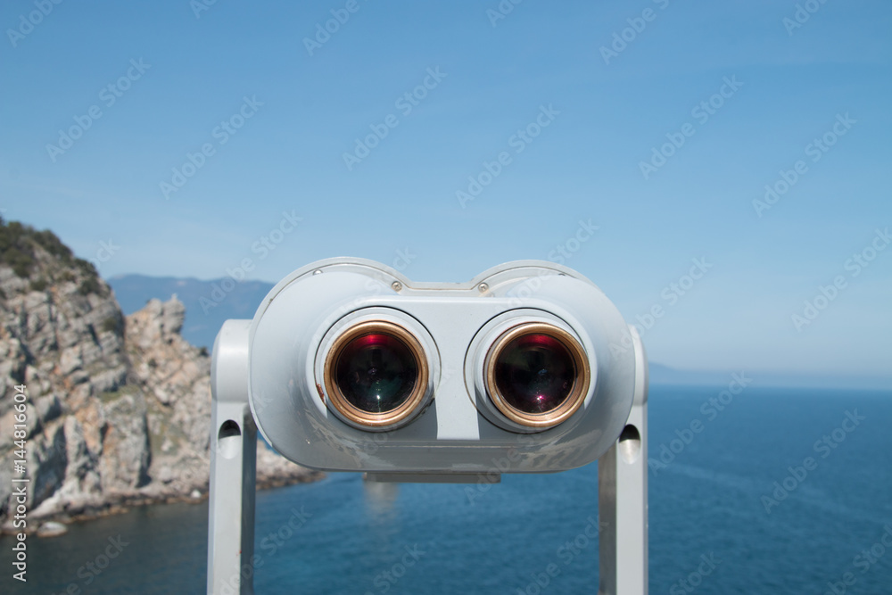 Binoculars and sea