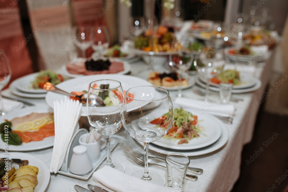 Catering services. Empty glasses set and food in restaurant
