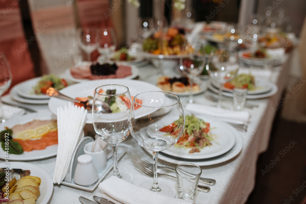 Catering services. Empty glasses set and food in restaurant Catering services. Empty glasses set and food in restaurant