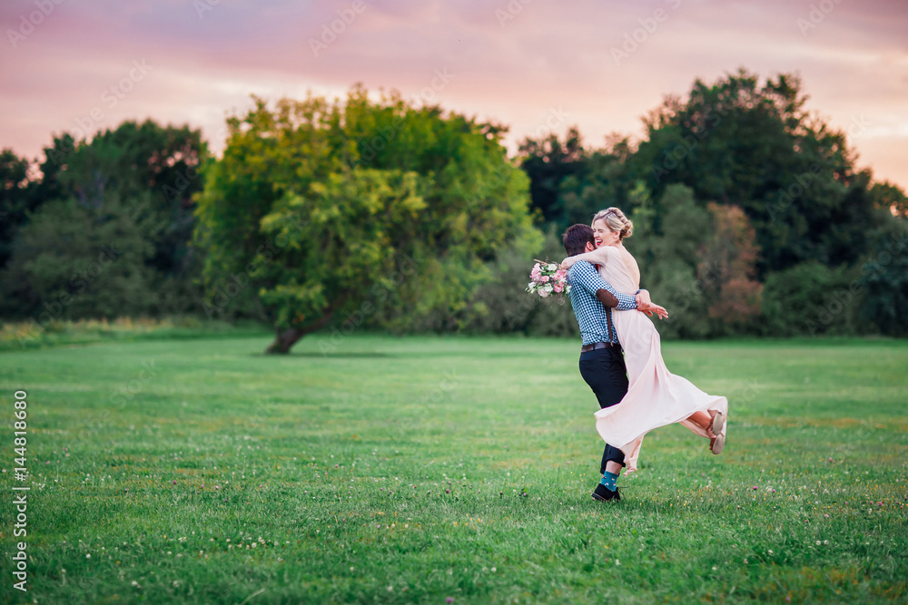The groom circling the bride on hands. The groom circling the bride on hands.