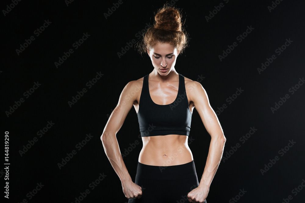 Strong fitness woman posing in studio Strong fitness woman posing in studio