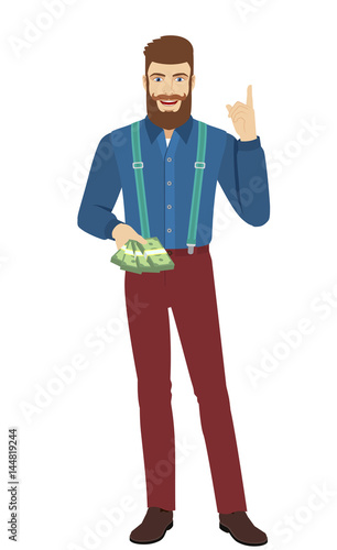 Hipster with cash money pointing up