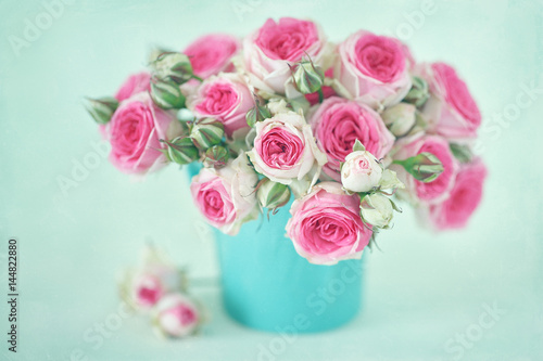 Close-up floral composition with a pink roses .Many beautiful fresh pink roses on a table. 